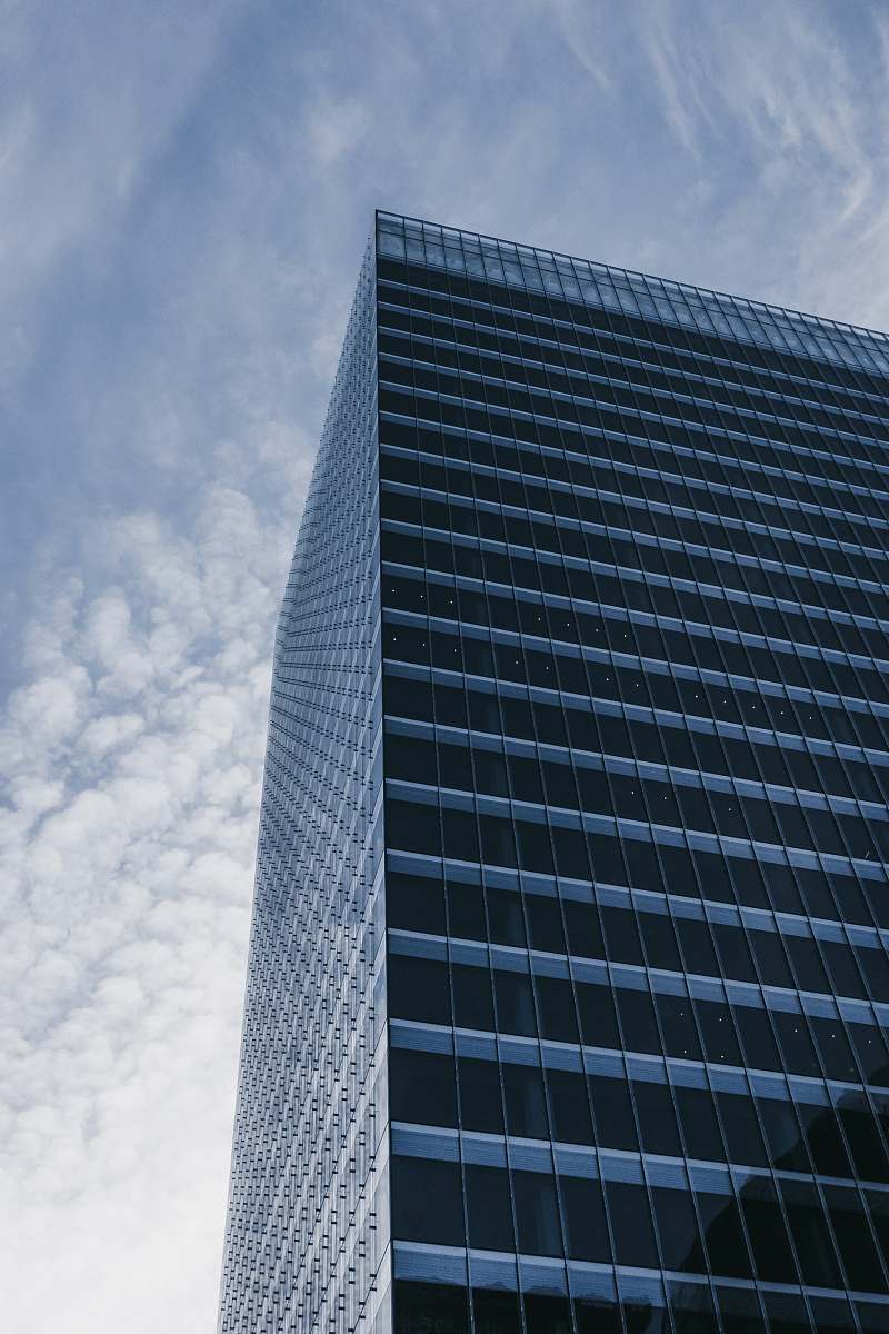 office building high rise building under white sky city